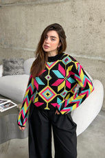 Яскравий светрик з орнаментом